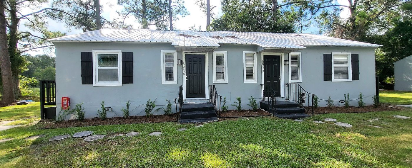 Gray single-story duplex at Oak Hill