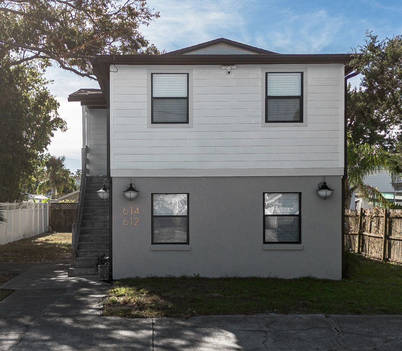 Gray and white two-story building at Jax Beach