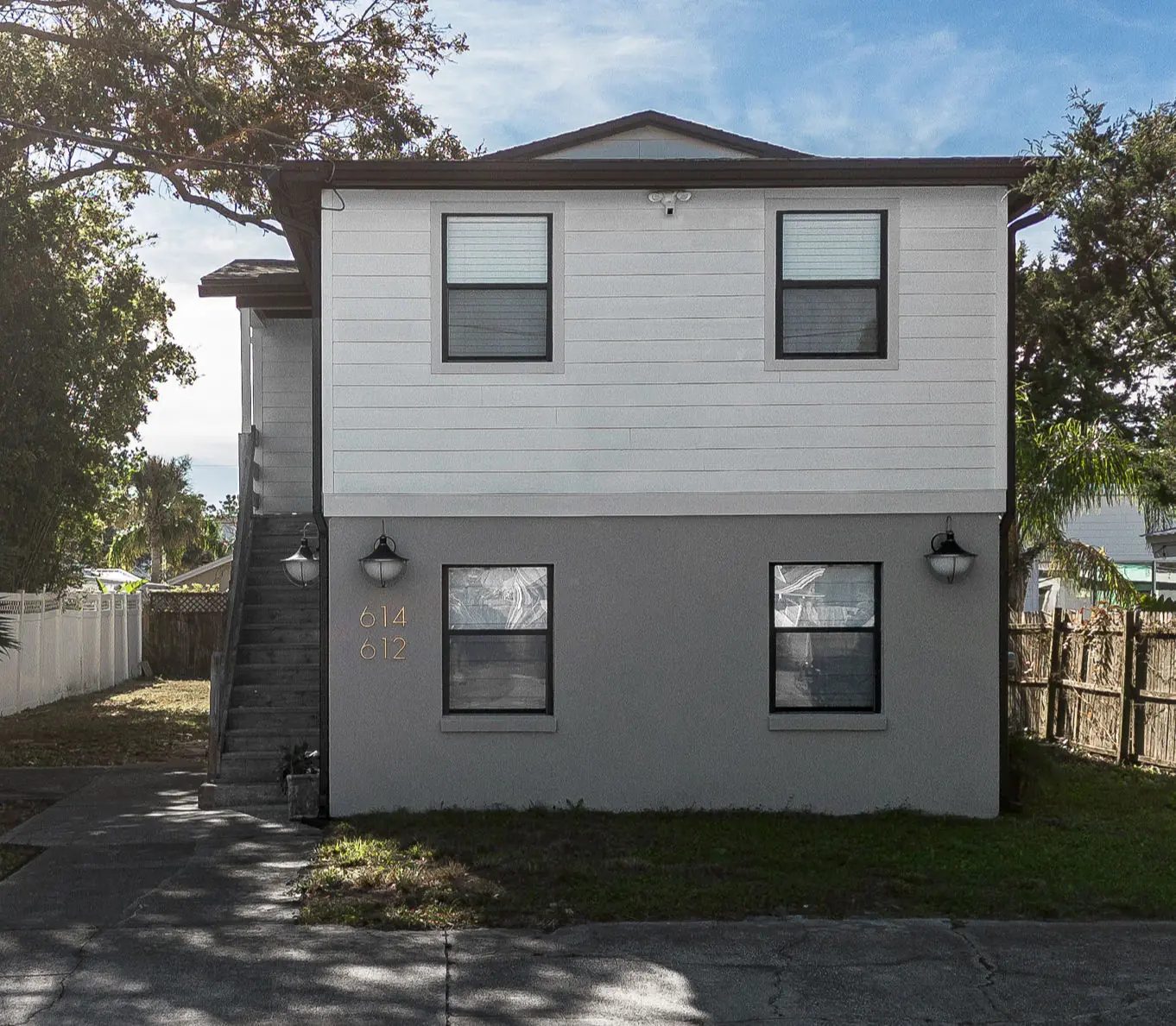 Gray and white two-story building at Jax Beach
